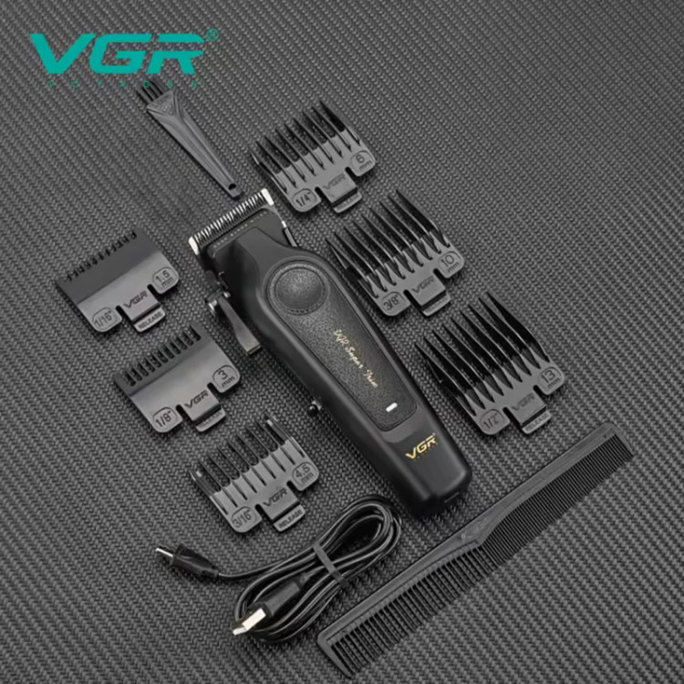 ماشین اصلاح موی سر و صورت شارژی وی جی ار مدل V-197 با تیغه استیل ضدزنگ، 6 شانه قابل تنظیم، اندازه اصلاح 0.2 میلیمتر، مناسب استفاده حرفهای و خانگی و آرایشگاهی